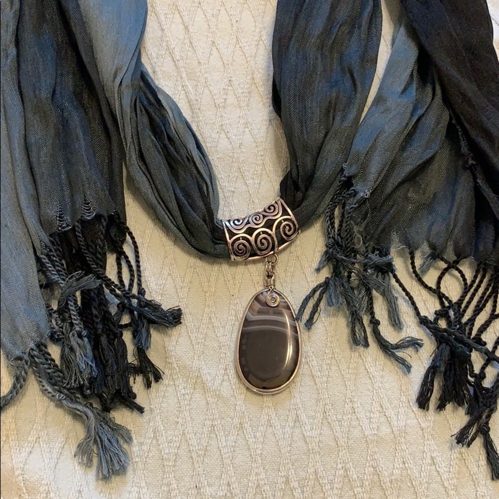 Silky-soft scarf with pendant